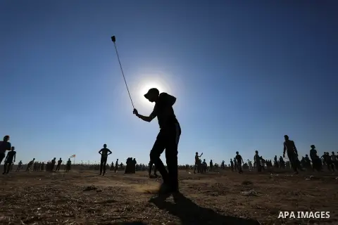 Palestinian protesters clash with Israeli troops following the tents protest where Palestinians demand the right to return to their homeland at the Israel-Gaza border, in Khan Younis in the southern Gaza Strip, July 05,...