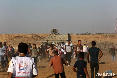 A wounded Palestinian protester is evacuated during clashes with Israeli troops following the tents protest where Palestinians demand the right to return to their homeland at the Israel-Gaza border, in Khan Younis in the...