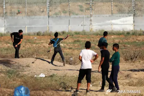 Palestinian protesters clash with Israeli troops following the tents protest where Palestinians demand the right to return to their homeland at the Israel-Gaza border, east of Gaza city, July 05, 2019. Photo by Mahmoud N...