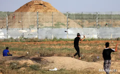 Palestinian protesters clash with Israeli troops following the tents protest where Palestinians demand the right to return to their homeland at the Israel-Gaza border, east of Gaza city, July 05, 2019. Photo by Mahmoud N...