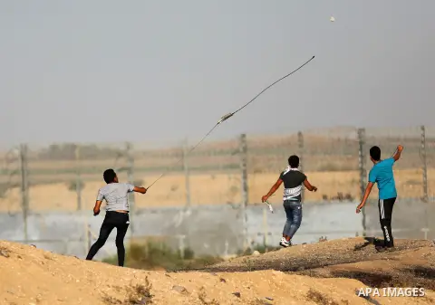 Palestinian protesters clash with Israeli troops following the tents protest where Palestinians demand the right to return to their homeland at the Israel-Gaza border, east of Gaza city, July 05, 2019. Photo by Mahmoud N...