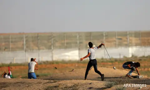 Palestinian protesters clash with Israeli troops following the tents protest where Palestinians demand the right to return to their homeland at the Israel-Gaza border, east of Gaza city, July 05, 2019. Photo by Mahmoud N...