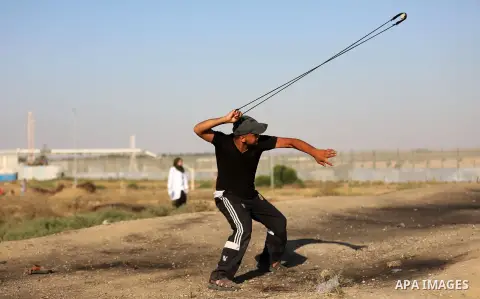 Palestinian protesters clash with Israeli troops following the tents protest where Palestinians demand the right to return to their homeland at the Israel-Gaza border, east of Gaza city, July 05, 2019. Photo by Mahmoud N...