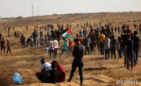 Palestinian protesters clash with Israeli troops following the tents protest where Palestinians demand the right to return to their homeland at the Israel-Gaza border, east of Gaza city, July 05, 2019. Photo by Mahmoud N...