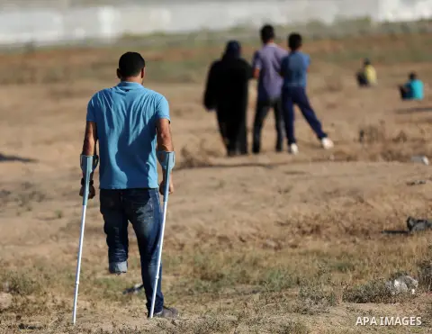 Palestinian protesters clash with Israeli troops following the tents protest where Palestinians demand the right to return to their homeland at the Israel-Gaza border, east of Gaza city, July 05, 2019. Photo by Mahmoud N...