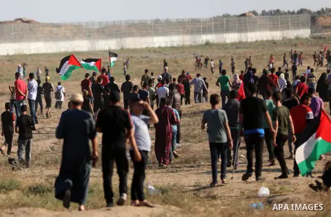 Palestinian protesters clash with Israeli troops following the tents protest where Palestinians demand the right to return to their homeland at the Israel-Gaza border, east of Gaza city, July 05, 2019. Photo by Mahmoud N...