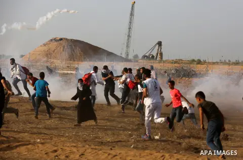 A wounded Palestinian protester is evacuated during clashes with Israeli troops following the tents protest where Palestinians demand the right to return to their homeland at the Israel-Gaza border, in Khan Younis in the...