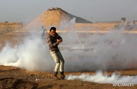 Palestinian protesters clash with Israeli troops following the tents protest where Palestinians demand the right to return to their homeland at the Israel-Gaza border, in Khan Younis in the southern Gaza Strip, July 12,...