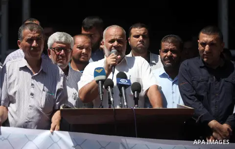 Palestinian supporters of the Islamic Jihad movement take part during a protest to show solidarity with Palestinian Prisoner, Jafar Izz Aldin on hunger strike at Israeli jails, in Gaza City on July 14, 2019. Photo by Mah...