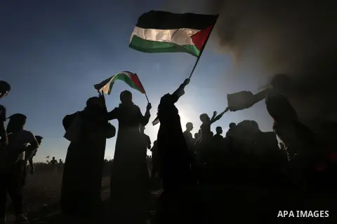 Palestinian protesters clash with Israeli troops following the tents protest where Palestinians demand the right to return to their homeland at the Israel-Gaza border, in Khan Younis in the southern Gaza Strip, July 19,...