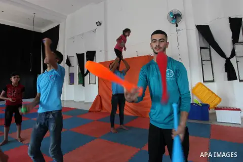 Members of Gaza stars circus perform during a training sesson in Gaza city, July 31, 2019. The Gaza Circus School which was founded two years ago and survives on donations. Photo by Mahmoud Ajjour