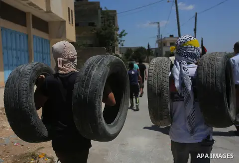 Palestinian protesters clash with Israeli security forces following a protest against the nearby Jewish settlement of Qadomem, in the village of Kofr Qadom in the Israeli-occupied West Bank August 9, 2019. Photo by Ayman...