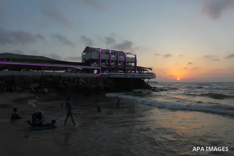 Palestinians enjoy at the beach along the shore of the Mediterranean Sea, two days before back to school, in Gaza City on August 23, 2019. Photo by Mahmoud Ajjour