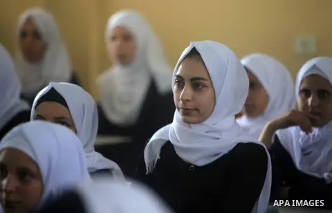 Palestinian students sit inside a classroom at their school in the morning of the first day of the new year study in Gaza City, on August 25, 2019. Photo by Mahmoud Ajjour