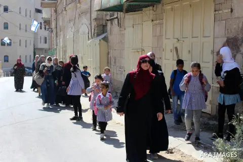 Palestinian students leave their school during the visit of Prime Minister Benjamin Netanyahu, in the West Bank city of Hebron, September 4, 2019. Netanyahu will take part in a ritual in the Jewish settlement in the city...