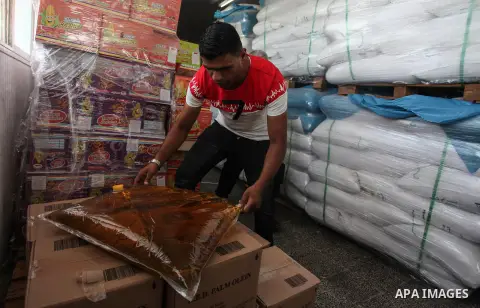 Palestinian employees of Economic ministry in the Gaza Strip inspect food products in a local factory, during a campaign to protect consumers, in Gaza city on September 05, 2019. Photo by Mahmoud Ajjour