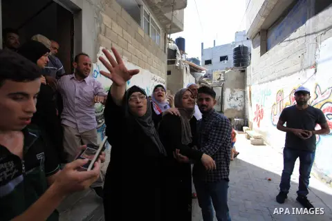 Relatives of Palestinian Khaled al-Rabie, 14, who was shot dead by Israeli forces at the Israel-Gaza border, mourn during his funeral in Gaza city, on September 7, 2019. Photo by Mahmoud Ajjour