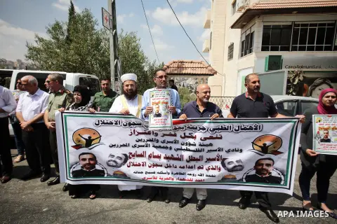 Palestinians take part in a protest against the death of the prisoner Bassam Al-Sayeh in the in the Israeli jails, outside the Red Cross headquarter in the West Bank city of Bethlehem, September 09, 2019. Al-Sayeh, 47, w...