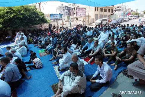 Palestinian supporters of Islamic Jihad movement attend Friday prayers in front of Red Cross office, to show solidarity with prisoners on hunger strike, in Israeli jails, in Gaza city on September 13, 2019. Photo by Mahm...