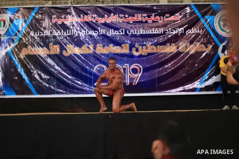 A Palestinian contestant takes part the Palestine Bodybuilding Championship in Gaza City, on september 15, 2019. Photo by Mahmoud Ajjour