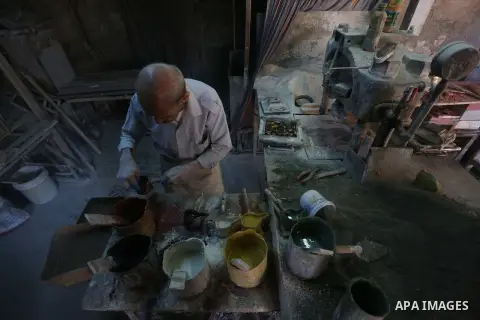 A Palestinian man Hani Rihan, 81, works on a traditional handmade and coloured tiles in the oldest tile factory since 1947, in the West Bank city of Nablus, on September 17, 2019. The Aslan factory in Nablus remains the...