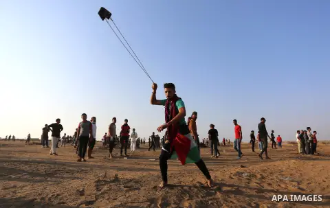 Palestinian protesters clash with Israeli troops following the tents protest where Palestinians demand the right to return to their homeland at the Israel-Gaza border, in Khan Younis in the southern Gaza Strip, Spetember...