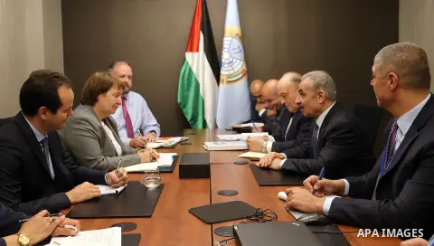 Palestinian Prime Minister Mohammad Ishtayeh meets with European Union envoy to the Middle East peace process Susanna Terstal and Swiss envoy to the peace process Ronald Stinger in the West Bank city of Ramallah, on Sept...