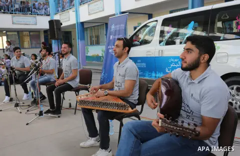 Palestinian students attend the Sea and Freedom Festival, at their school run by the United Nations Relief and Works Agency (UNRWA), in Beit Hanoun in the northern Gaza Strip, on September 26, 2019. Photo by Ashraf Amra