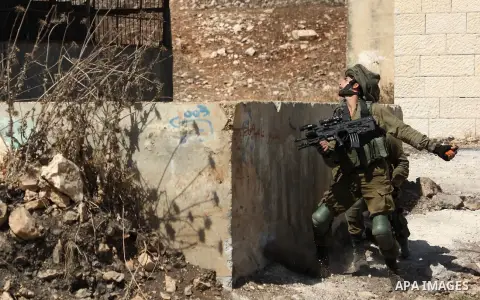 Israeli security forces take position during clashes with Palestinian protesters following a weekly demonstration against the expropriation of Palestinian land by Israel in the village of Kfar Qaddum, near the West Bank...