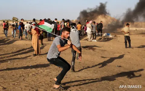 Palestinian protesters clash with Israeli troops following the tents protest where Palestinians demand the right to return to their homeland at the Israel-Gaza border, in Khan Younis in the southern Gaza Strip, Spetember...