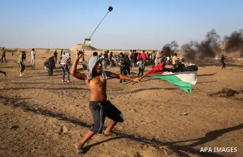 Palestinian protesters clash with Israeli troops following the tents protest where Palestinians demand the right to return to their homeland at the Israel-Gaza border, in Khan Younis in the southern Gaza Strip, Spetember...