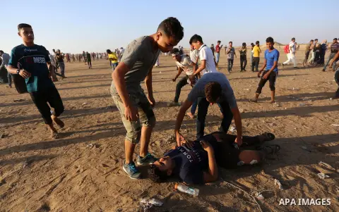 Palestinian protesters clash with Israeli troops following the tents protest where Palestinians demand the right to return to their homeland at the Israel-Gaza border, in Khan Younis in the southern Gaza Strip, Spetember...