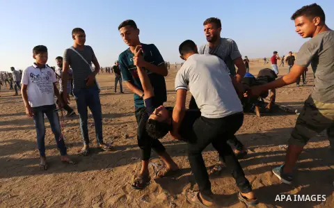 Palestinian protesters clash with Israeli troops following the tents protest where Palestinians demand the right to return to their homeland at the Israel-Gaza border, in Khan Younis in the southern Gaza Strip, Spetember...