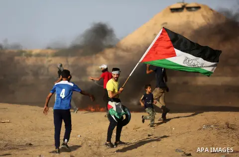 Palestinian protesters clash with Israeli troops following the tents protest where Palestinians demand the right to return to their homeland at the Israel-Gaza border, in Khan Younis in the southern Gaza Strip, Spetember...