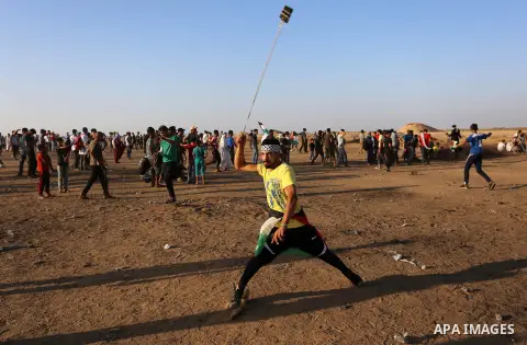 Palestinian protesters clash with Israeli troops following the tents protest where Palestinians demand the right to return to their homeland at the Israel-Gaza border, in Khan Younis in the southern Gaza Strip, Spetember...