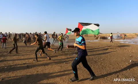 Palestinian protesters clash with Israeli troops following the tents protest where Palestinians demand the right to return to their homeland at the Israel-Gaza border, in Khan Younis in the southern Gaza Strip, Spetember...