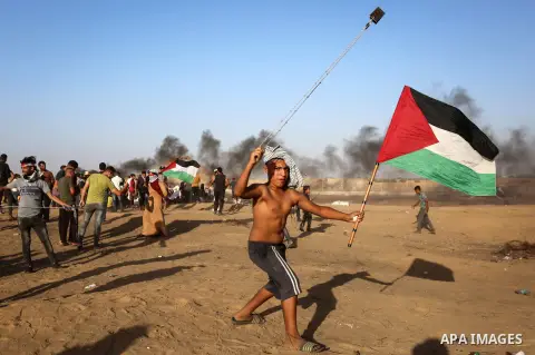 Palestinian protesters clash with Israeli troops following the tents protest where Palestinians demand the right to return to their homeland at the Israel-Gaza border, in Khan Younis in the southern Gaza Strip, Spetember...