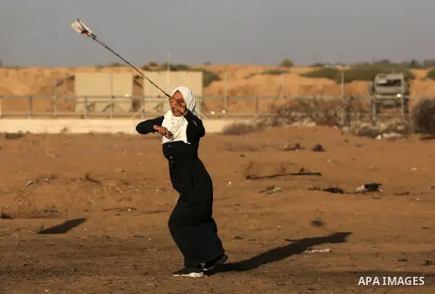 Palestinian protesters clash with Israeli troops following the tents protest where Palestinians demand the right to return to their homeland at the Israel-Gaza border, in Khan Younis in the southern Gaza Strip, Spetember...
