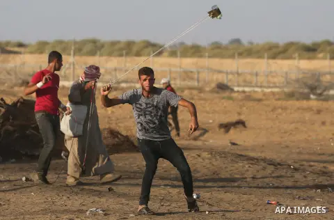 Palestinian protesters clash with Israeli troops following the tents protest where Palestinians demand the right to return to their homeland at the Israel-Gaza border, in Khan Younis in the southern Gaza Strip, Spetember...