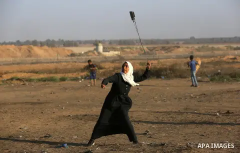Palestinian protesters clash with Israeli troops following the tents protest where Palestinians demand the right to return to their homeland at the Israel-Gaza border, in Khan Younis in the southern Gaza Strip, Spetember...