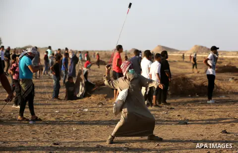 Palestinian protesters clash with Israeli troops following the tents protest where Palestinians demand the right to return to their homeland at the Israel-Gaza border, in Khan Younis in the southern Gaza Strip, Spetember...