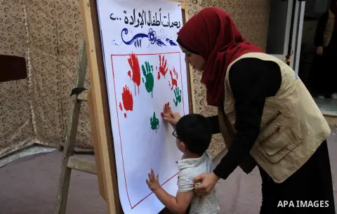 Palestinian children who are autistic paly during an entertainment day, in Gaza city, on September 28, 2019. Autism is a developmental disorder characterized by difficulties with social interaction and communication. Pho...