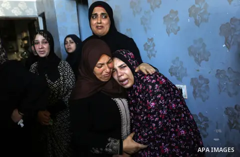 Relatives of Palestinian Saher Othman, 20, who was died of his wounds which he sustained by Israeli forces during clashes in tents protest where Palestinians demand the right to return to their homeland at the Israel-Gaz...