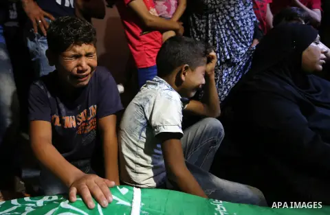 Mourners carry the body of Palestinian Saher Othman, 20, who was died of his wounds which he sustained by Israeli forces during clashes in tents protest where Palestinians demand the right to return to their homeland at...
