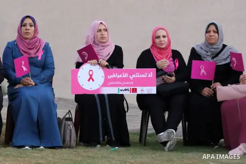 Palstininans take part in a rally during the Breast Cancer Awareness campaign at Gaza port in Gaza City, on October 1, 2019. Photo by Mahmoud Abu Hasira