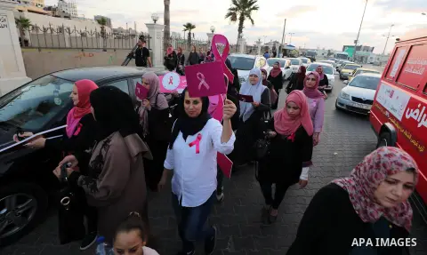 Palstininans take part in a rally during the Breast Cancer Awareness campaign at Gaza port in Gaza City, on October 1, 2019. Photo by Mahmoud Abu Hasira