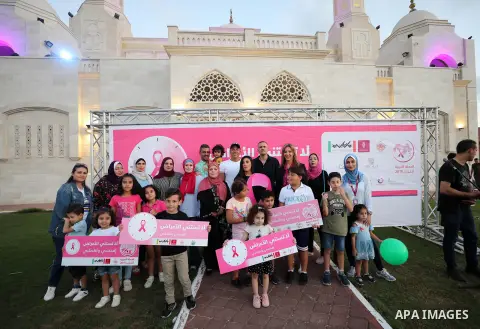 Palstininans take part in a rally during the Breast Cancer Awareness campaign at Gaza port in Gaza City, on October 1, 2019. Photo by Mahmoud Abu Hasira