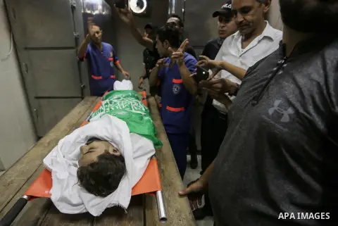 Mourners carry the body of Palestinian Fadi Hijazi, 21, who was died of his wounds which he sustained in February of this year by Israeli forces during clashes in tents protest where Palestinians demand the right to retu...