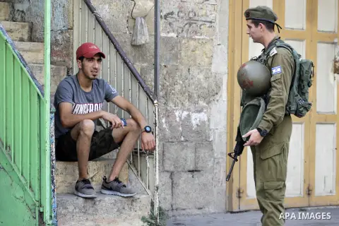 Israeli security forces and Jewish settlers close a street to mark the Sukkot (Feast of Tabernacles) which marks the exodus of the ancient Hebrew people from Egypt, in the West Bank city of Hebron on October 16, 2019. Sa...