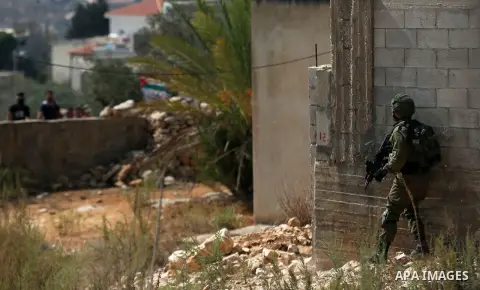 Israeli security forces take position during clashes with Palestinian protesters following a weekly demonstration against the expropriation of Palestinian land by Israel in the village of Kfar Qaddum, near the West Bank...